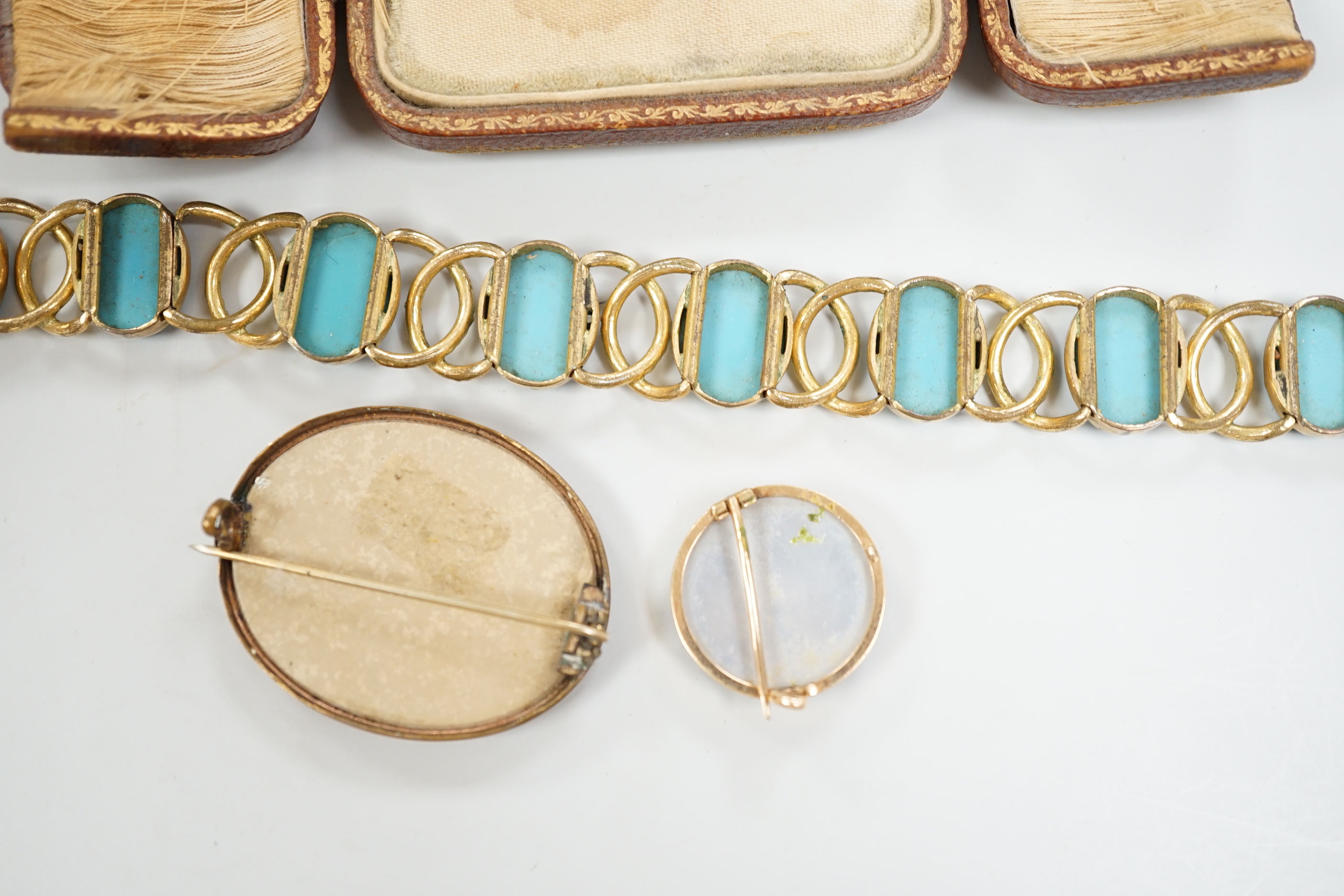 A Tassie style cased cameo, a micro-mosaic bracelet, a pietra dura brooch and a porcelain brooch.